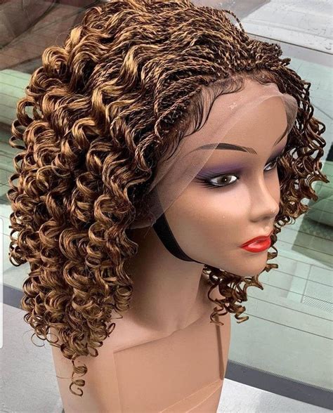 76 211. . Braided wigs with gold accent